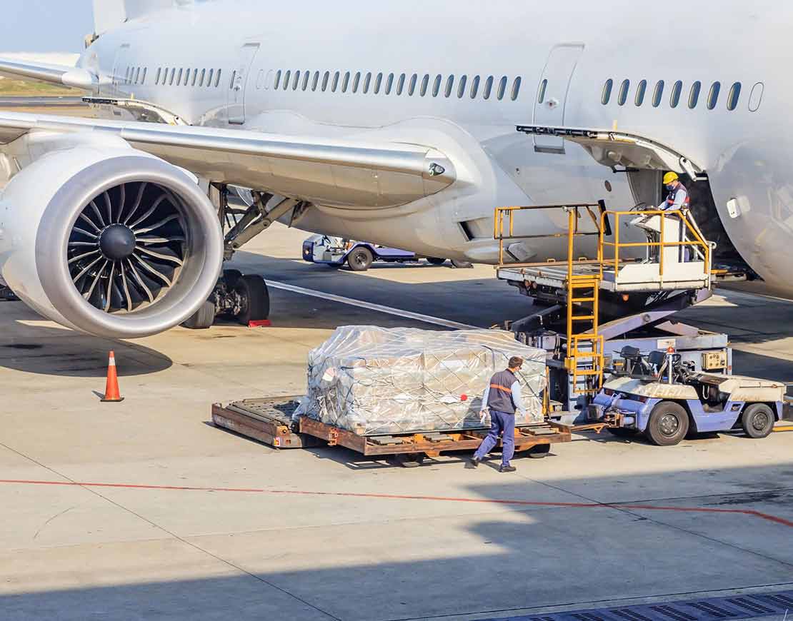 Cargo being loaded on cargo airplane for transport — air logistics