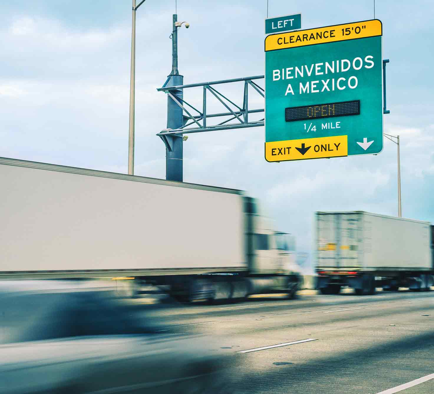 Photo of freight trucks going through the Mexican/USA border