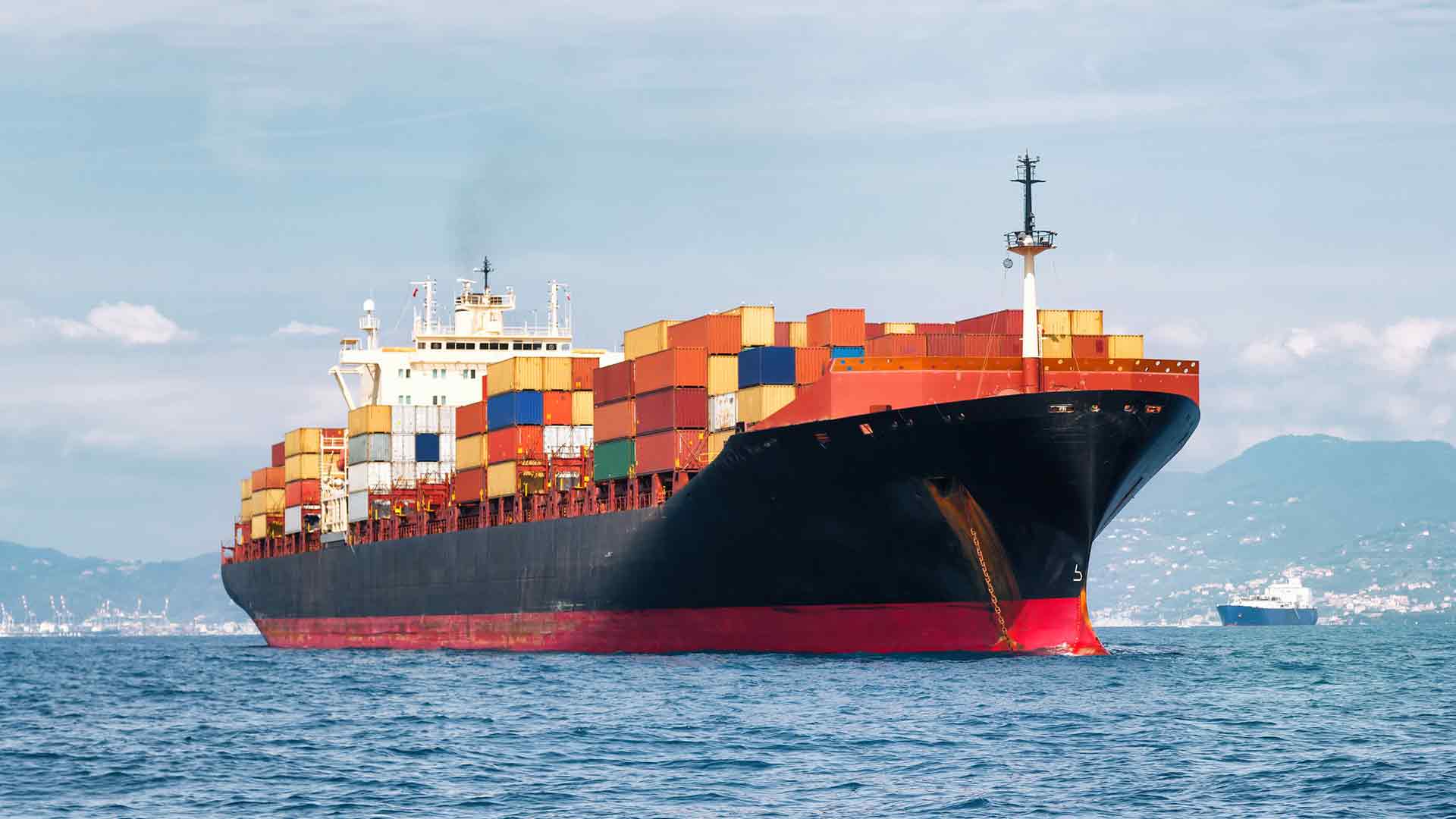 Photo of a ocean ship carrying containers